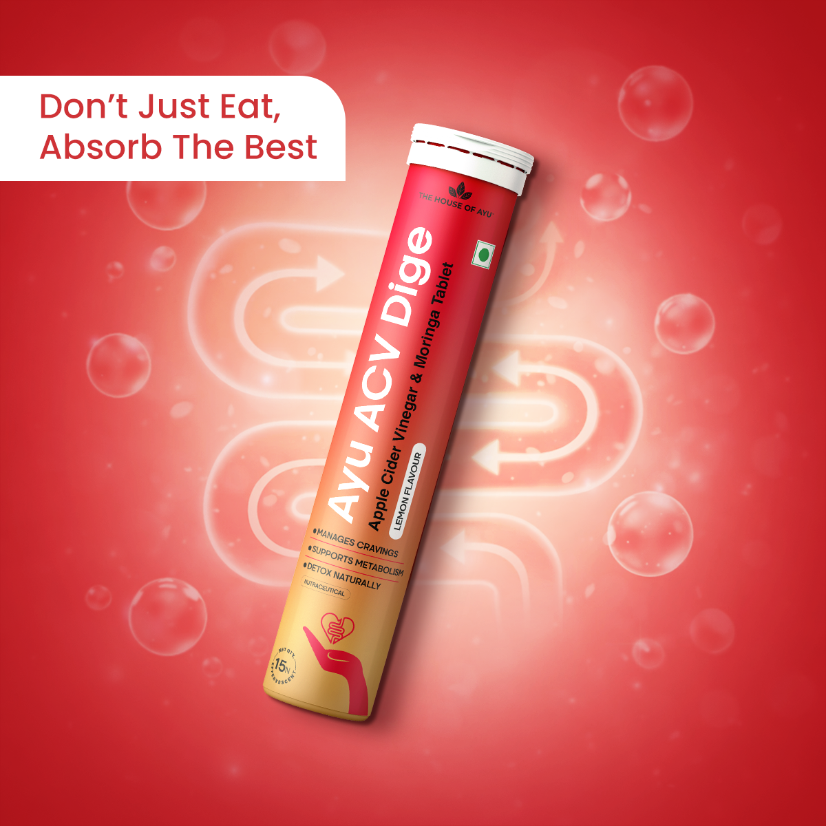 Red and gold supplement tube labeled 'AYU ACV Dige' on a red background with bubbles.