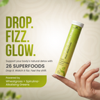 Ayu Daily Greens Plus with text 'Drop. Fizz. Glow.' on a light background